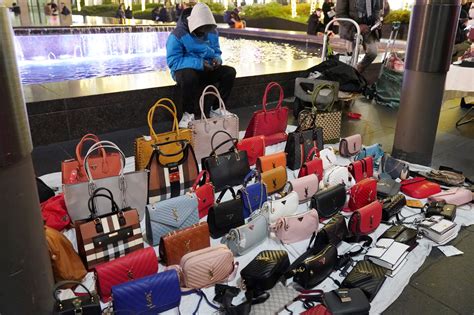 using fake designer products such as bags shoes and clothes|fashion designer handbags.